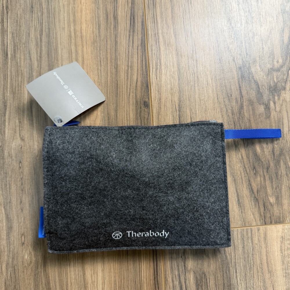 New THERABODY United Airlines Amenity Kit Grey Felt Unopened Everything Inside